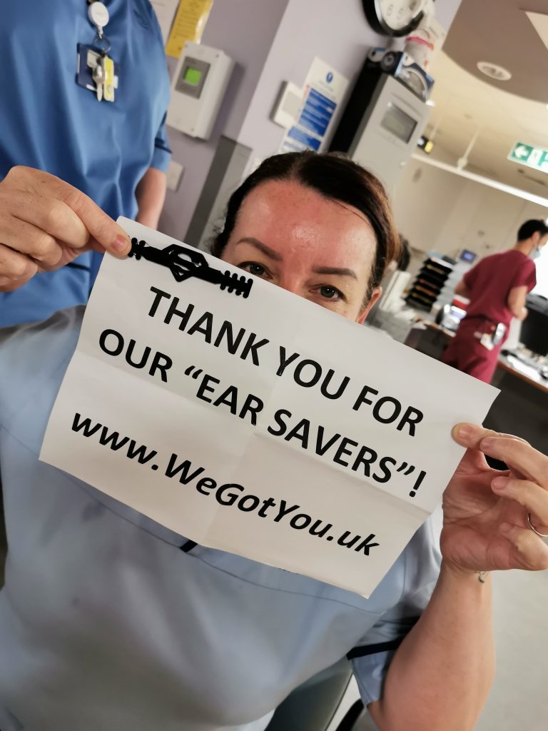 nhs fife employee with 3d printed ear saver donated by we got you